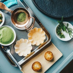 a tray of food on a blue table